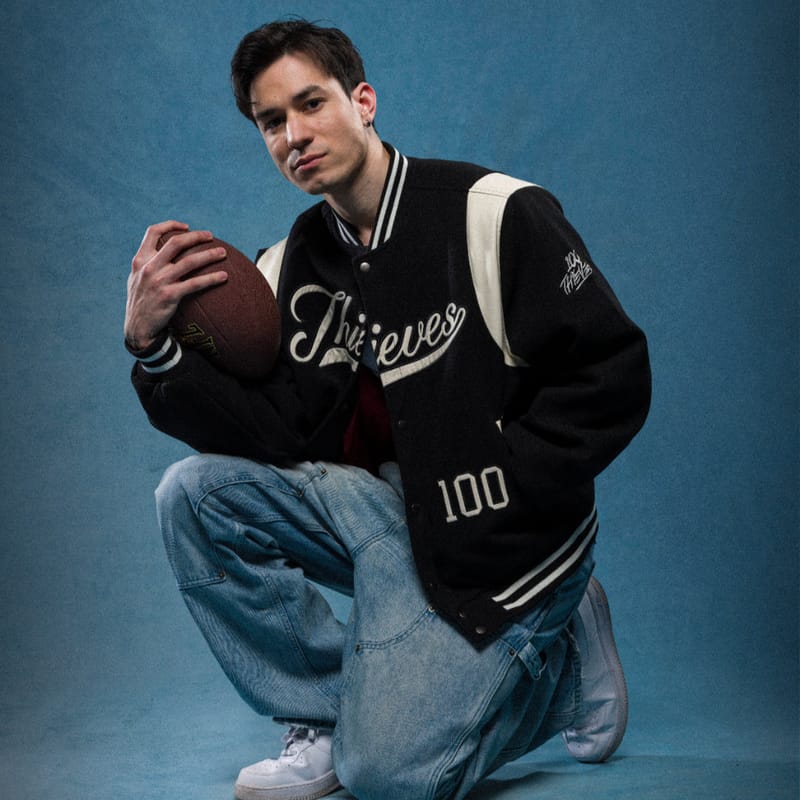 100 Thieves Dropout 26 varsity jacket lifestyle view